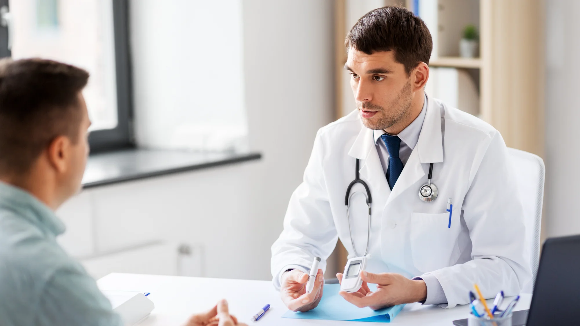 A doctor discussing treatment with a patient in a clinic setting